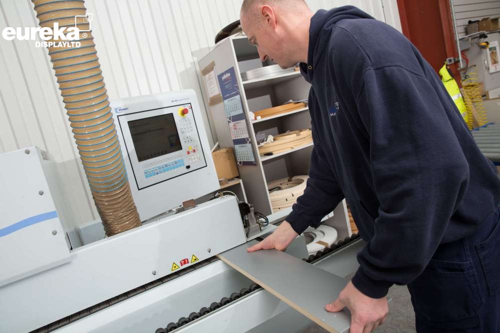 A man controling the computer on the Bandt machine