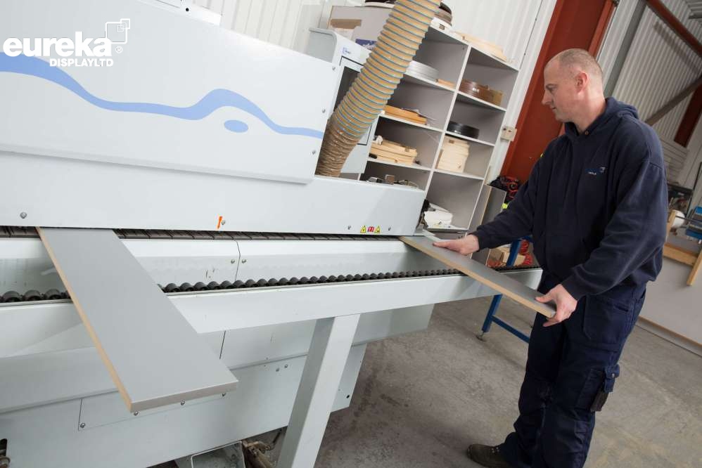 A straight line edge band being done