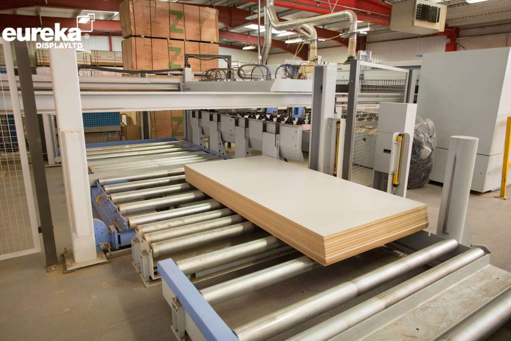 Boards being removed from the cutting machine after they have been cut